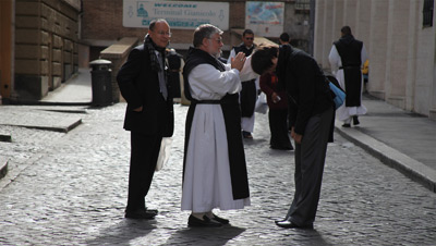 Father Abbot giving Maria a good-bye-blessing